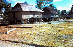 THATCH ROOF HOUSES IN KONTUM 1959/60 - Photo by ROSSIE RANKIN