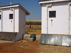 UDDTs at school with urine tank in the centre
